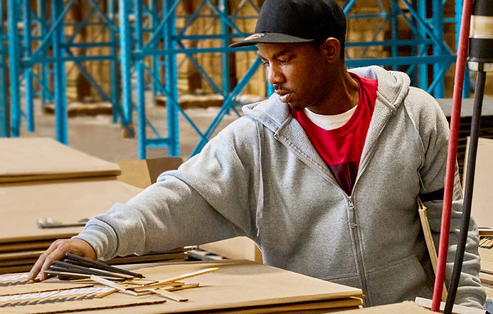 Employee building a frame.